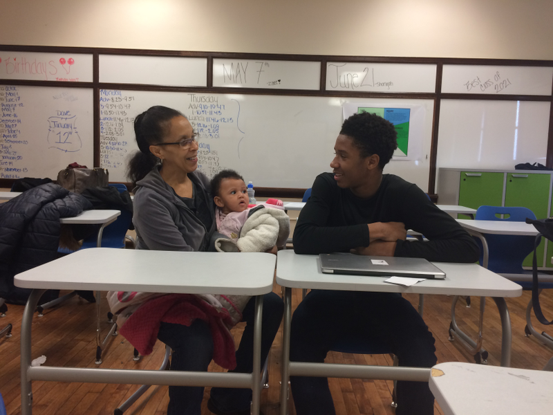 Ryan Moten, a freshman at Vaux, with his grandmother and baby sister, after he gave a school presentation about his plans for the future.